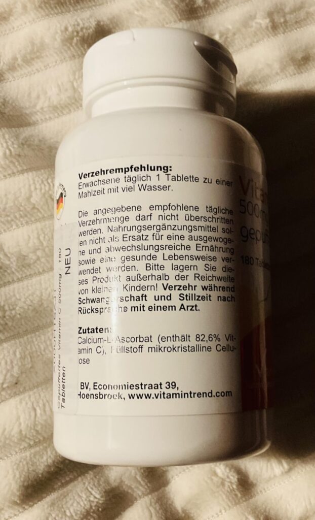 Dos du flacon de vitamine C, avec les informations nutritionnelles et d'utilisation.
